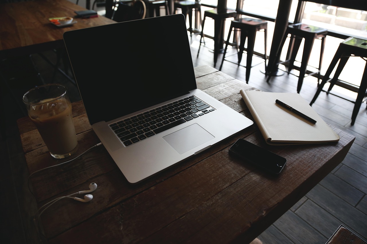 Planning notes and laptop on a desk (stock photo).