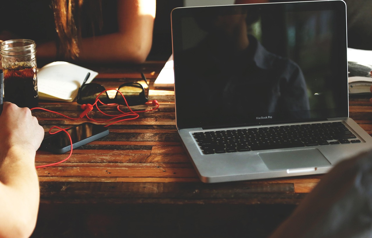 Startup workspace with laptop and coffee (stock photo).